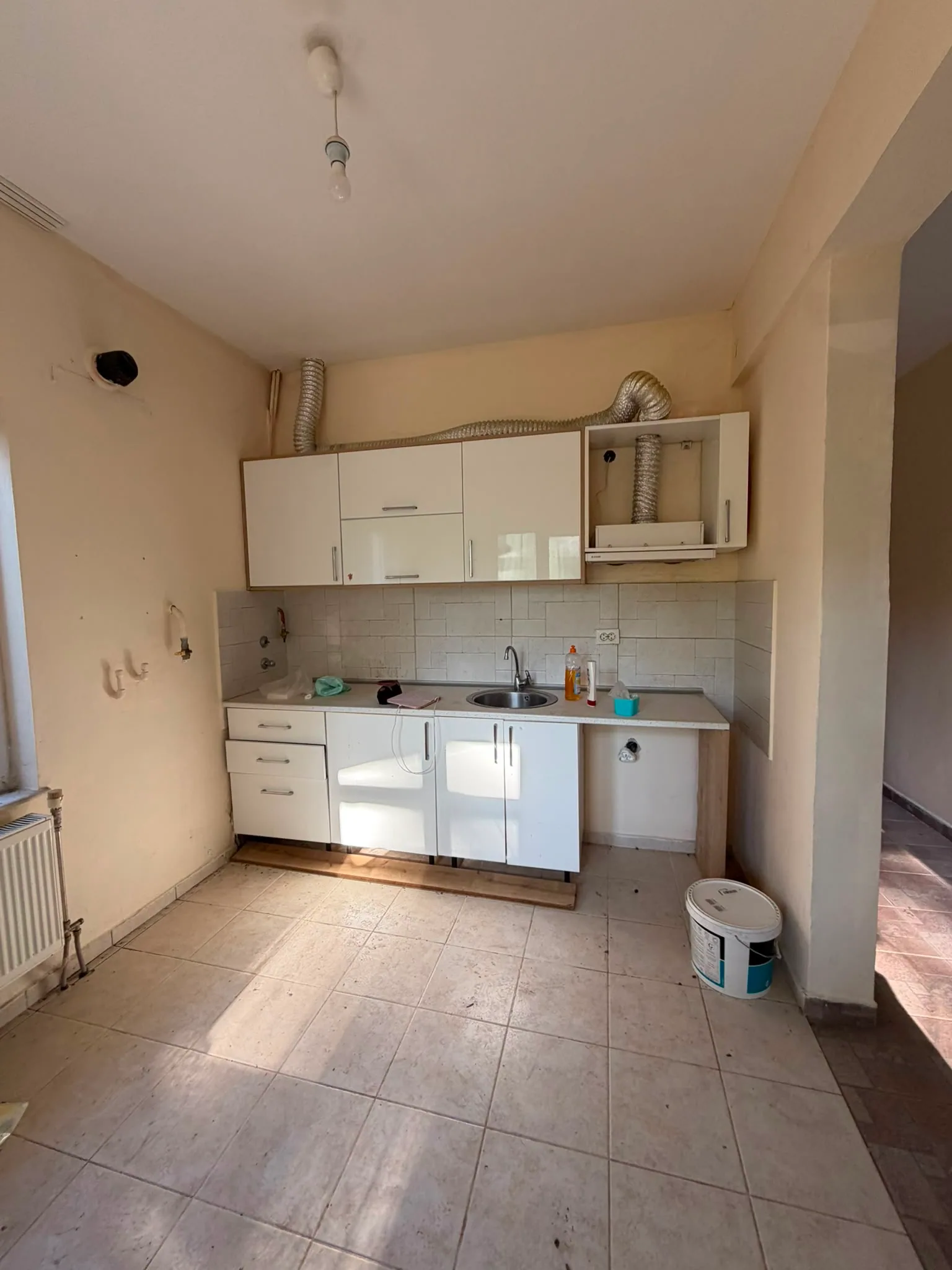 Existing condition before renovation: the kitchen as it stands